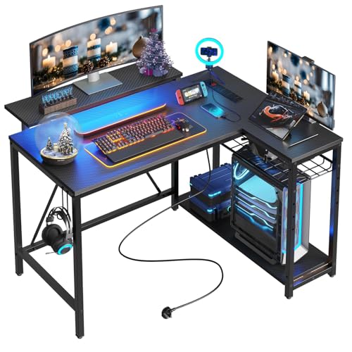 Bestier Small Gaming Desk with Power Outlets,42 L Shaped LED Computer Desk with Stand Reversible Shelves,Corner Gamer Desk with Headset Hooks USB Charging Port,Carbon Fiber Black